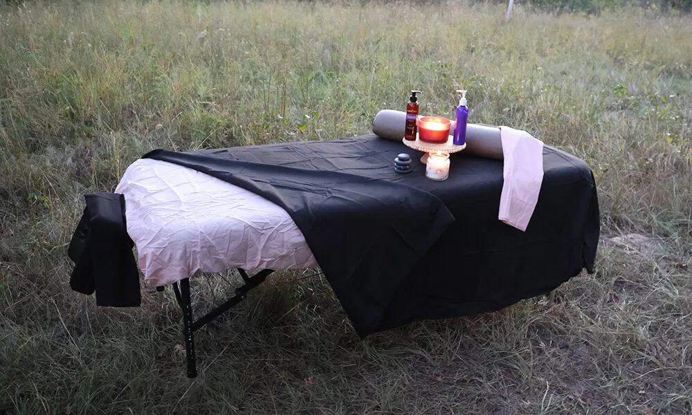 Table prepared for outdoor hot stone massage