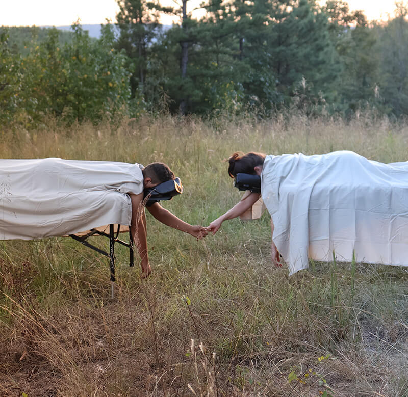 A couple getting a massage outdoors. 