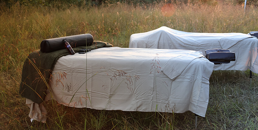 Massage tables in a field