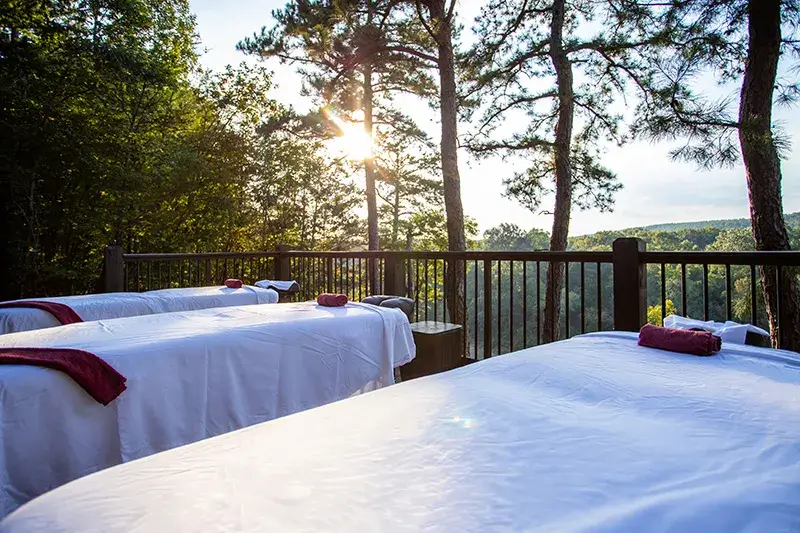 outdoor-massage-setup Three massage tables on a deck